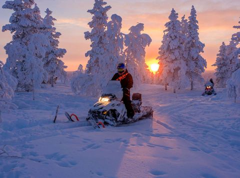 finnish lapland star arctic hotel snowmobile sunset