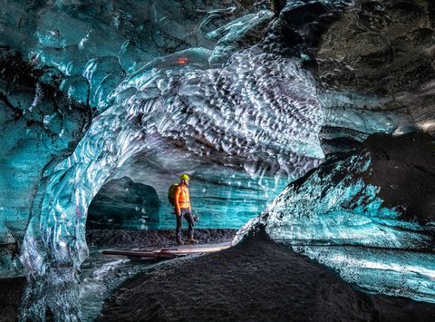 iceland ice cave lone figure head torch istk