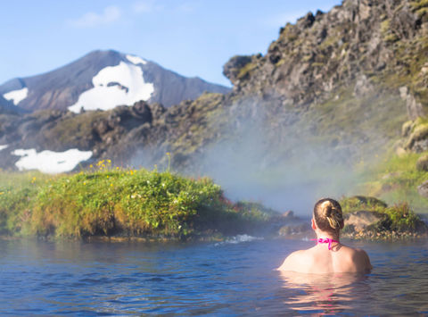 iceland woman relaxing in hot springs landmannalaugar astk