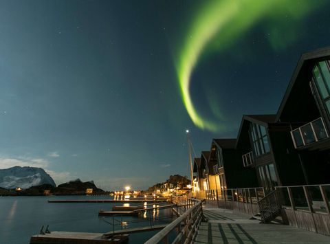 northern senja hamn i senja aurora over apartments
