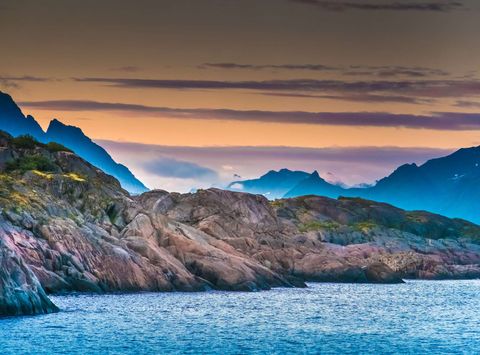norway midnight sun over lofoten landscape istk