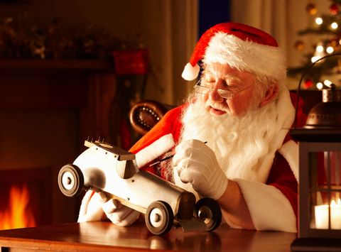 santa making toy istk
