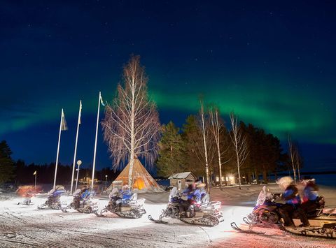 swedish lapland brandon lodge snowmobile train with aurora gr