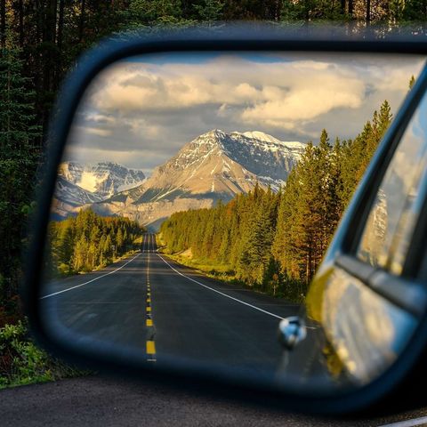 Wing mirror view of the Icefields Parkway