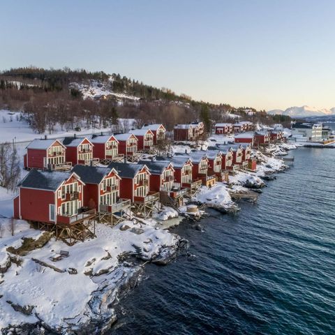 malangen resort cabins along fjord winter