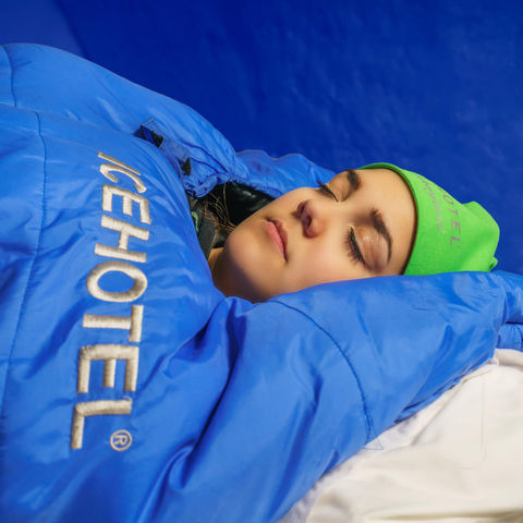 sweden-icehotel-sleeping-on-ice-in-sleeping-bag-rth