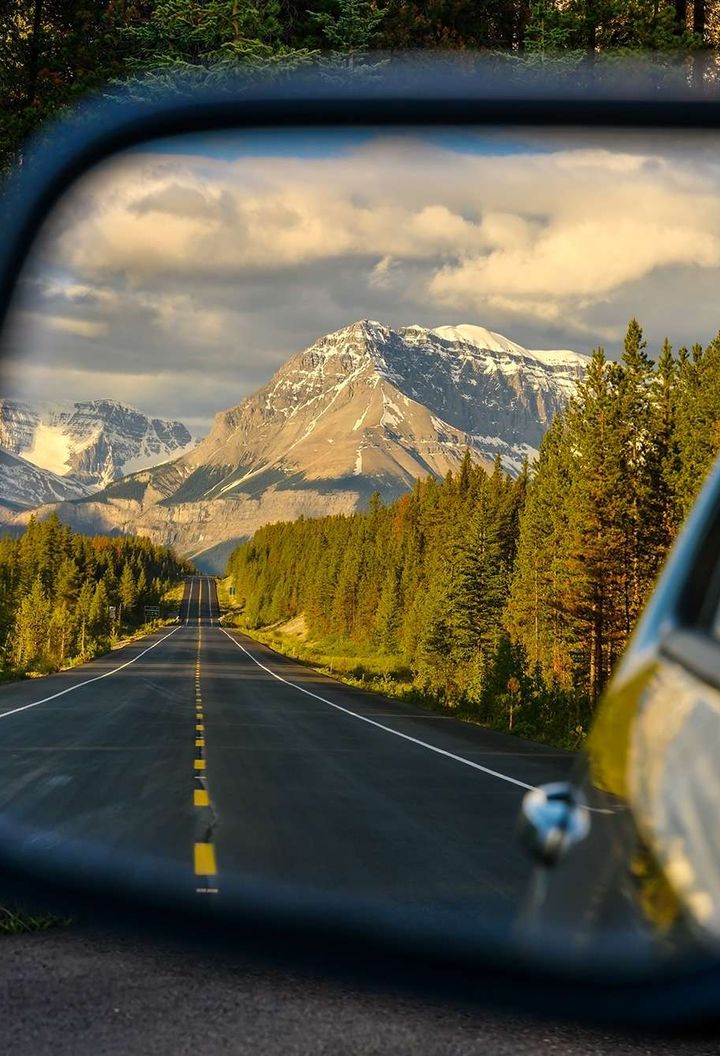 Wing mirror view of the Icefields Parkway