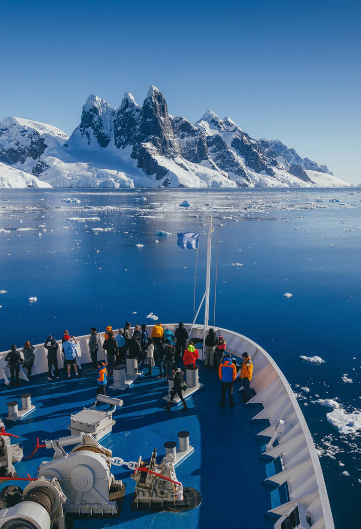 antarctic peninsula bow of ship cruising through tranquil channels qe