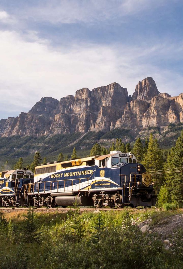 canada rocky mountaineer passing castle mountain rm