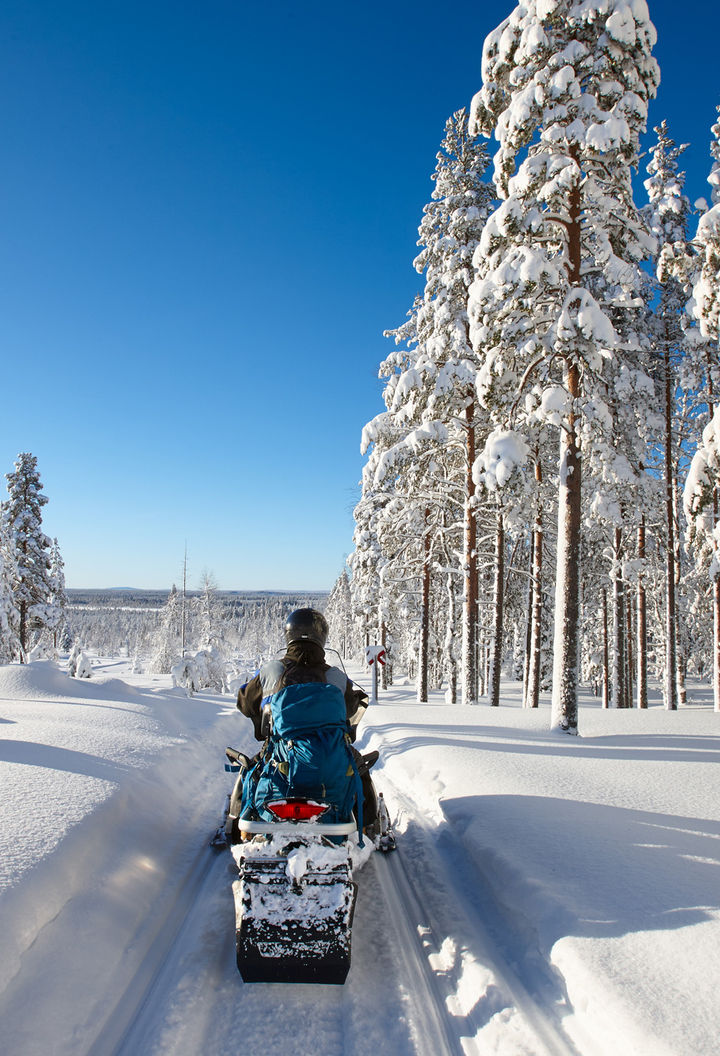 finland lapland snowmobile taiga sunshine istk