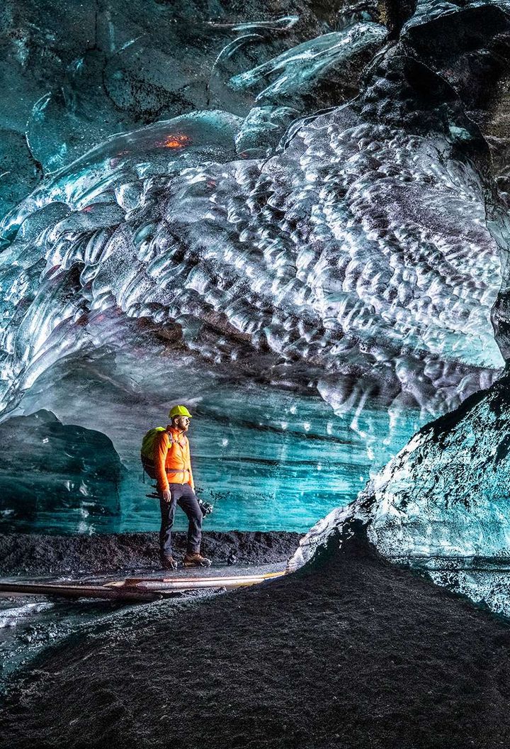 iceland ice cave lone figure head torch istk