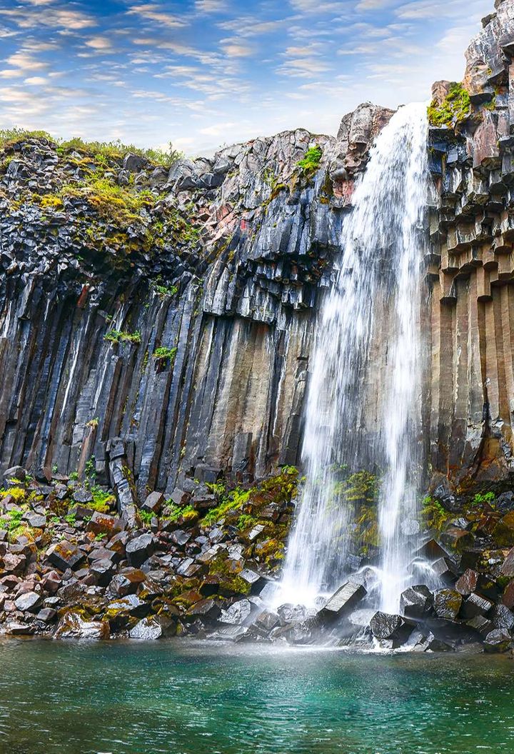 iceland svartifoss tumbling from basalt cliff istk