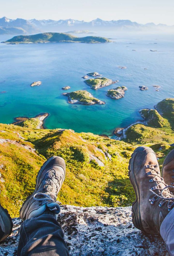 northern norway hikers resting at viewpoint senja istk