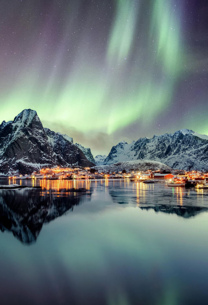 norway lofoten aurora over mountains reine istk