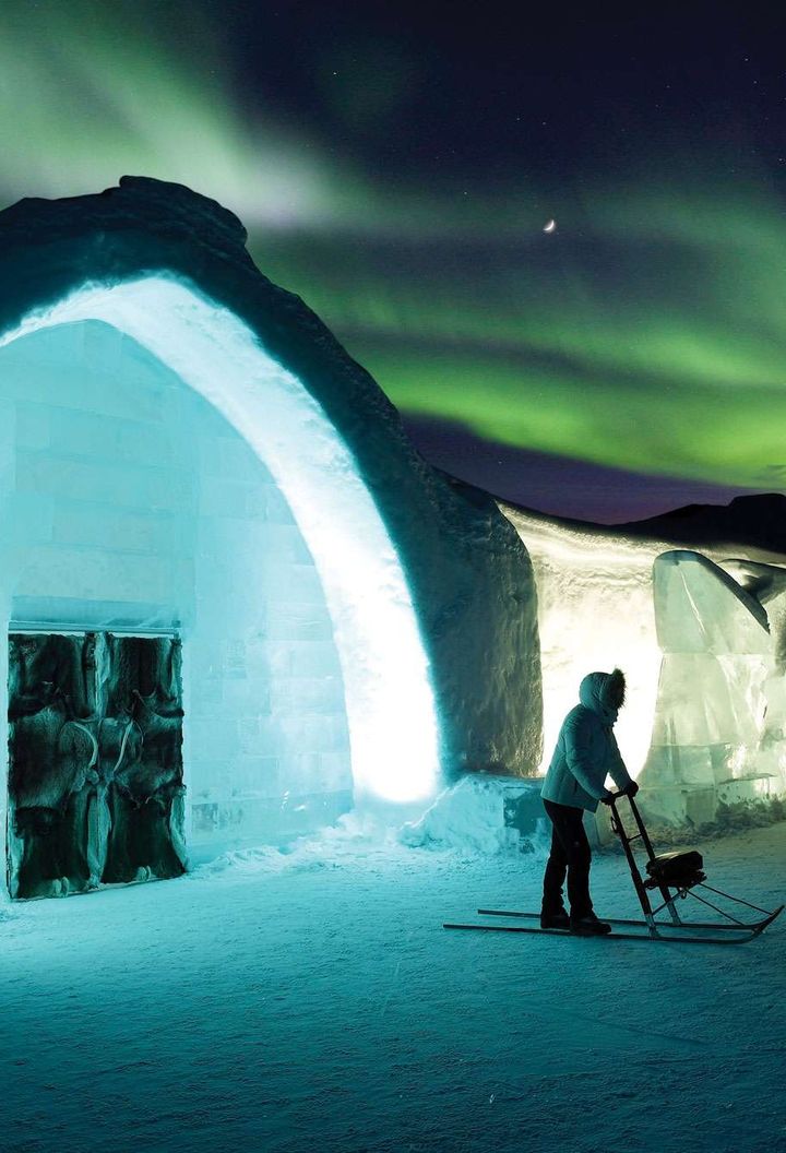 northern lights over the icehotel in Swedish Lapland