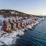 malangen resort cabins along fjord winter