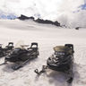 south iceland snowmobiles awaiting drivers on glacier istk