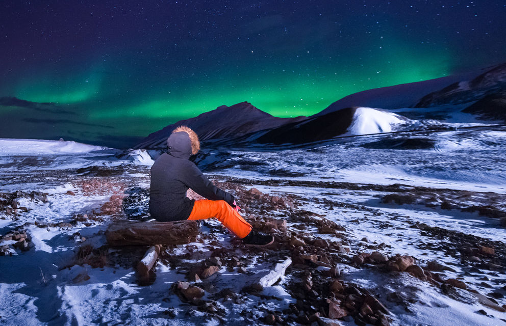 svalbard aurora with person istk